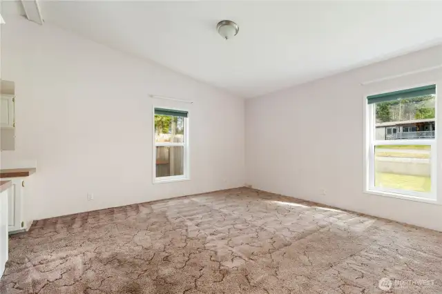 Primary bedroom is also spacious and vaulted with lots of natural light