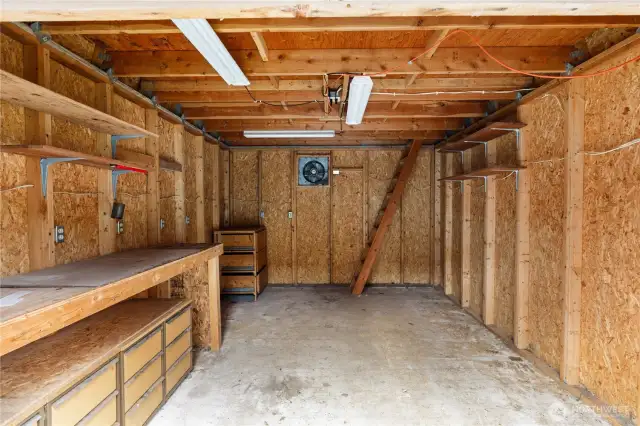 Inside lower portion of shed.  Electricity and shelving make this very usable for many things