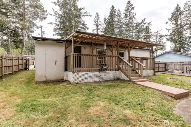 Back of house.  the storage to the left houses the water softner