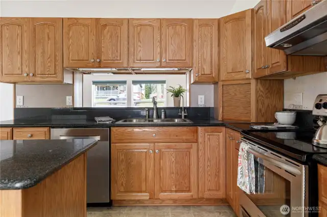 Appliance garage in corner keeps the kitchen tidy.  Plethora of cabinets