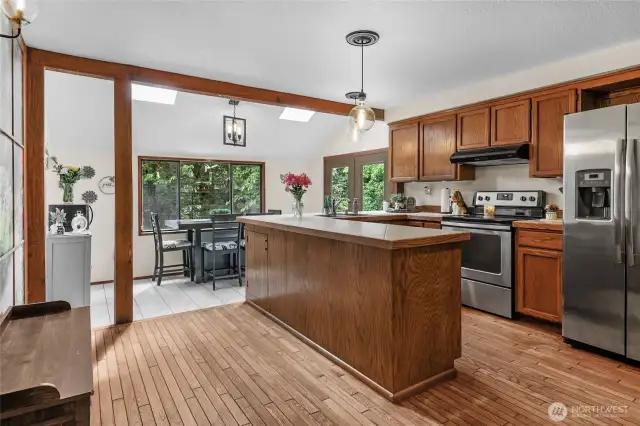 Kitchen – Ideal for entertaining with line-of-sight to living room and patio access just beyond.