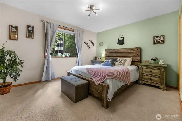 Bedroom #3 (Main Level) – Charming and peaceful with lush views of greenery just outside.
