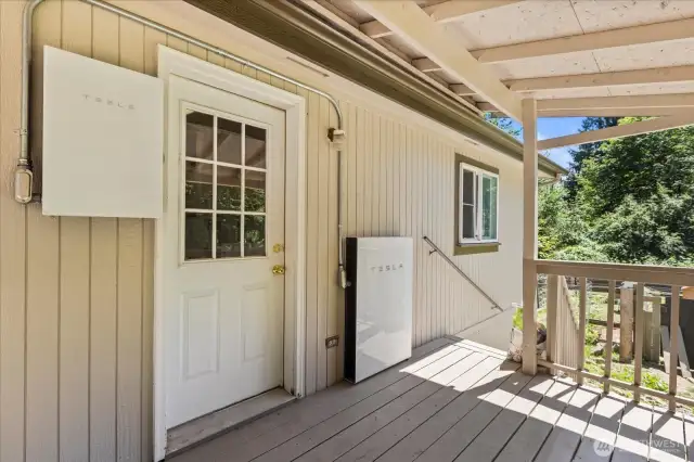 Covered deck with Tesla battery wall