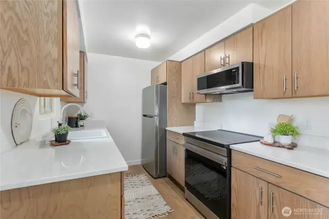All new oak cabinetry, and appliances - induction glass top range, microwave and Refrigerator
