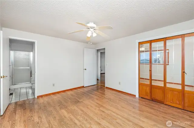 Primary bedroom with charming mirrored closet doors to oversized closet.