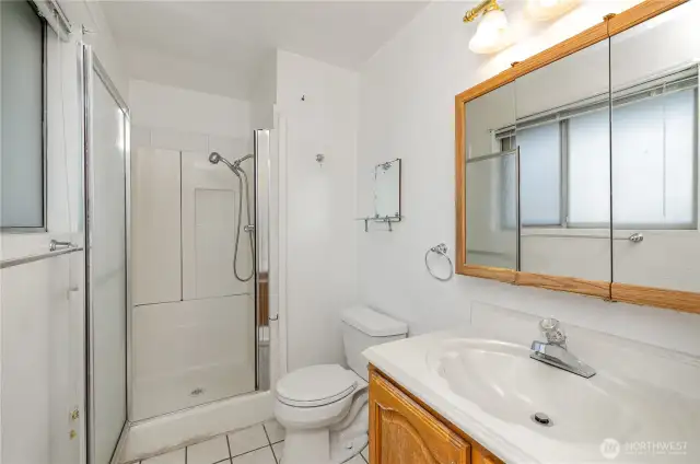 Primary 3/4 bathroom with all the necessities.