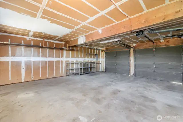 Large garage with plenty of space for storage.
