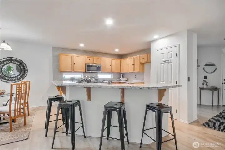 The kitchen includes a pantry offering plenty of storage for all  your cooking essentials.