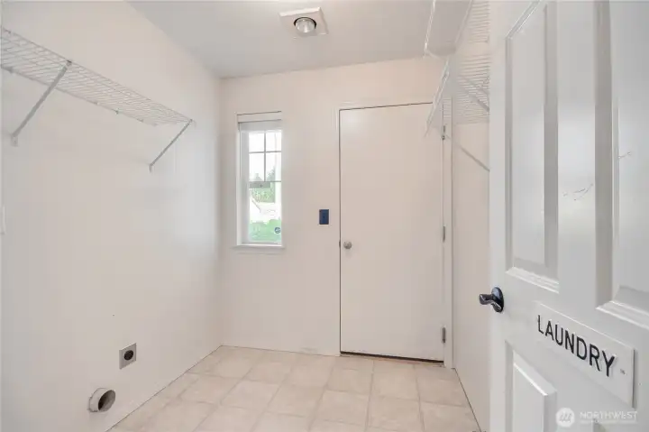 Laundry room is a perfect mud room with access to the 2 car garage.