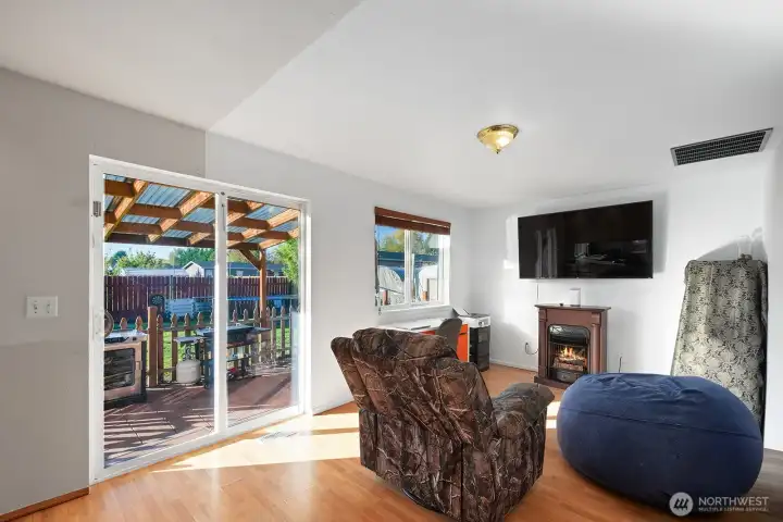 The family room opens out to a spacious back yard and covered patio - great for entertaining guests.