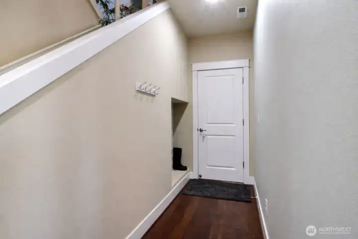 Access to a tandem 800 sq. ft.  four car garage. Shoe Cubby/Storage to left of door.