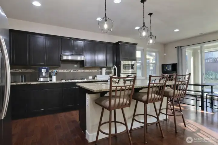 Spacious kitchen, breakfast nook and open concept living room.