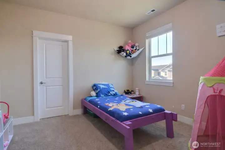 Bedroom Two. Plenty of room, door on the back wall leads to a walk-in closet.
