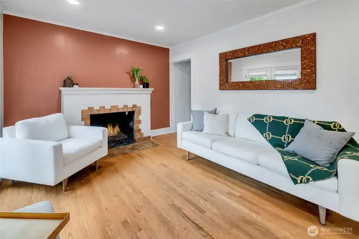 Wood burning fireplace flanks the living room