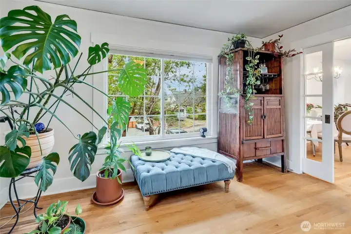 Den is a perfect lounge spot and is separated by glass French doors