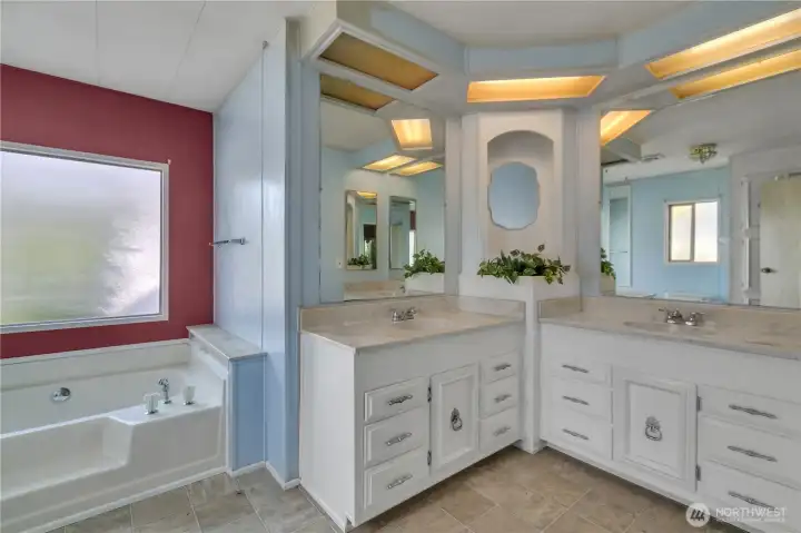 Primary bathroom with double vanities & a big soaking tub ~