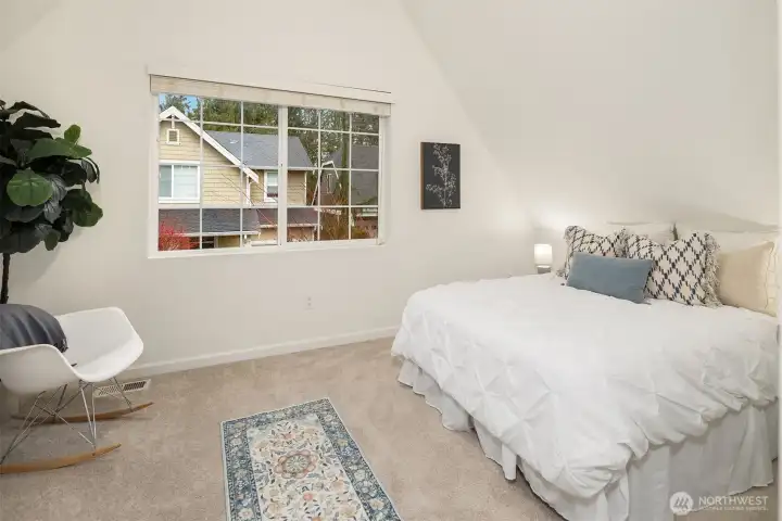 Another bedroom with vaulted ceilings.