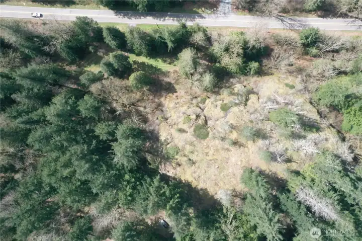 Aerial view of cliffs with May Creek RD at top of photo