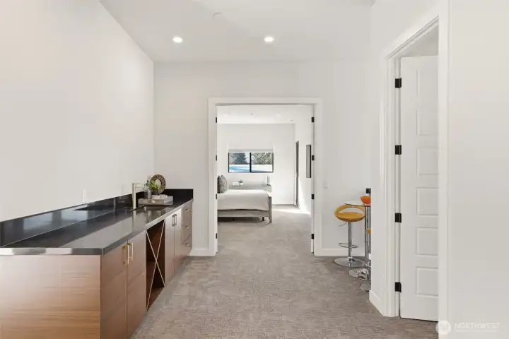 Head upstairs and enjoy wet bar near primary bedroom. Perfect coffee station to start the morning!