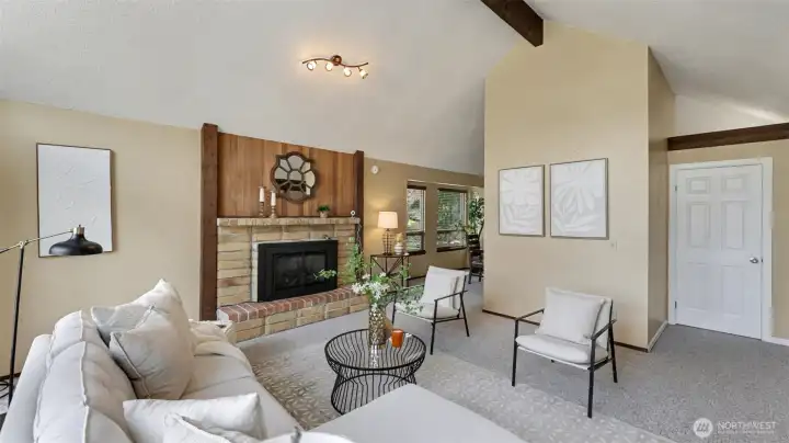 Exposed wood beams, rich trim, and vaulted ceilings create that timeless Northwest vibe.