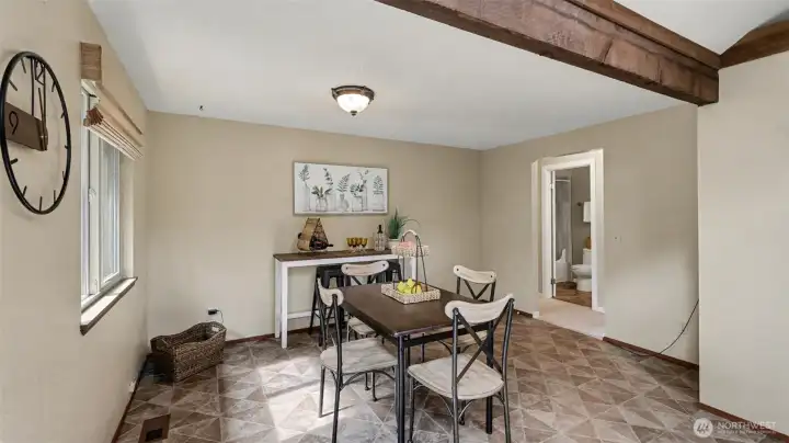 Area off of the kitchen  could also make an additional living space.