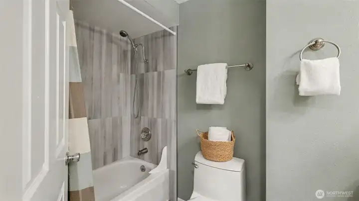 Tile shower and quartz counters.