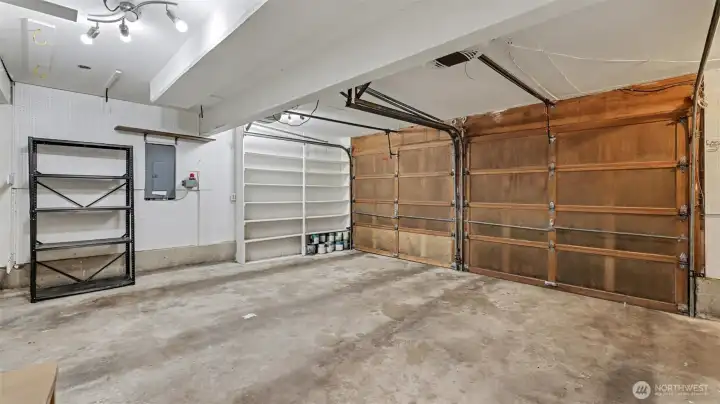 Large 2 car garage, shelving stays.