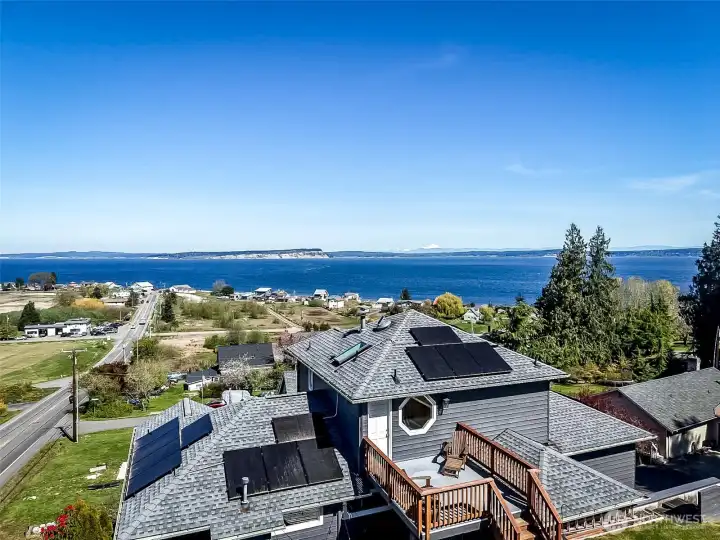Sweeping views of the sound await on ever level of this amazing home!