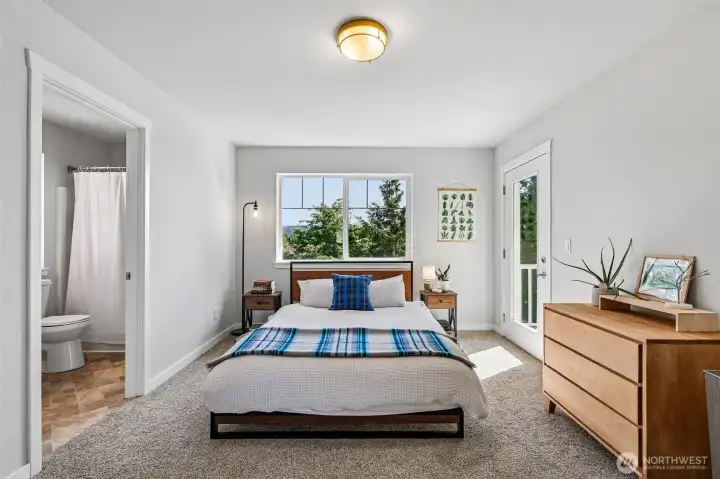 Primary bedroom overlooking greenbelt
