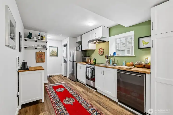 Kitchenette with dishwasher, stove/range and refrigerator (microwave is tenant's own)