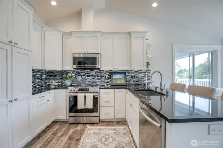Stainless appliances and freshly painted kitchen cabinets