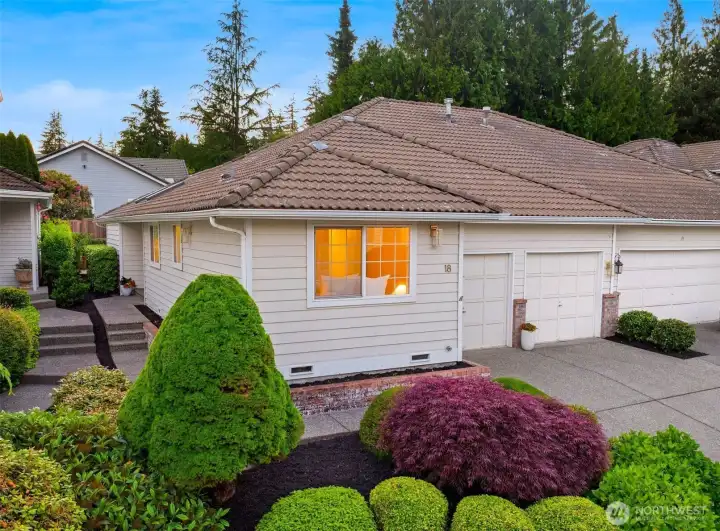 Wrap around private entrance + two-car attached garage.