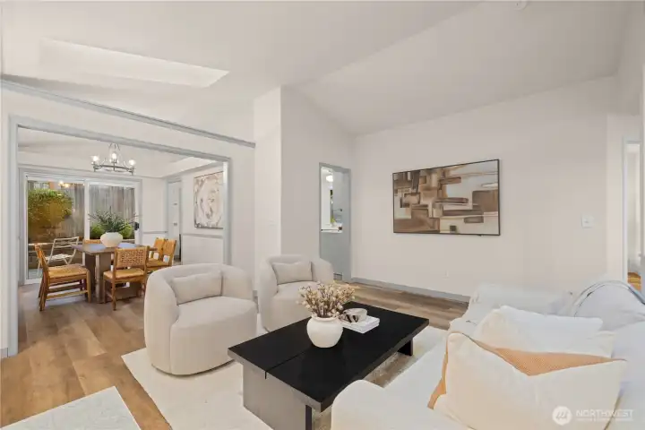 Living room leads into both the formal dining room and kitchen.