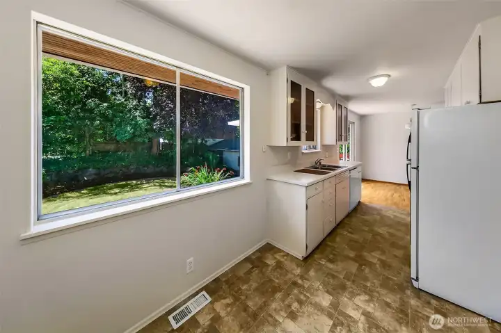 Kitchen w/ Eating Nook & View of Yard.