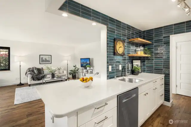 Blue tile backsplash accent is inspired by the color of Blue Skies & the waters of Elliott Bay!