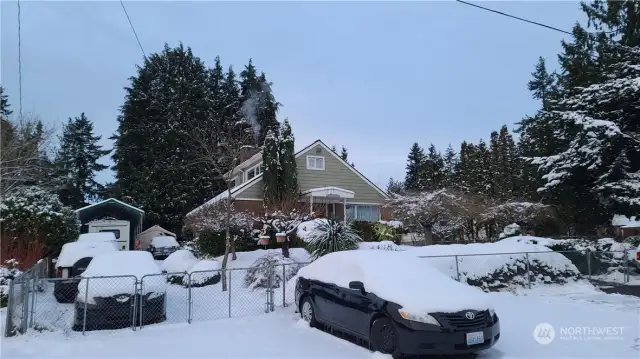 front view of the house facing south on 127th Street. Plenty of street parking spaces in front of the house.