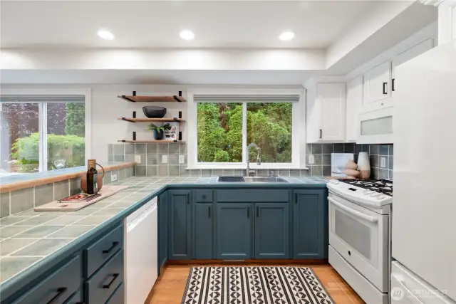 A well laid out kitchen with new Bosch Dishwasher, ne GE Fridge