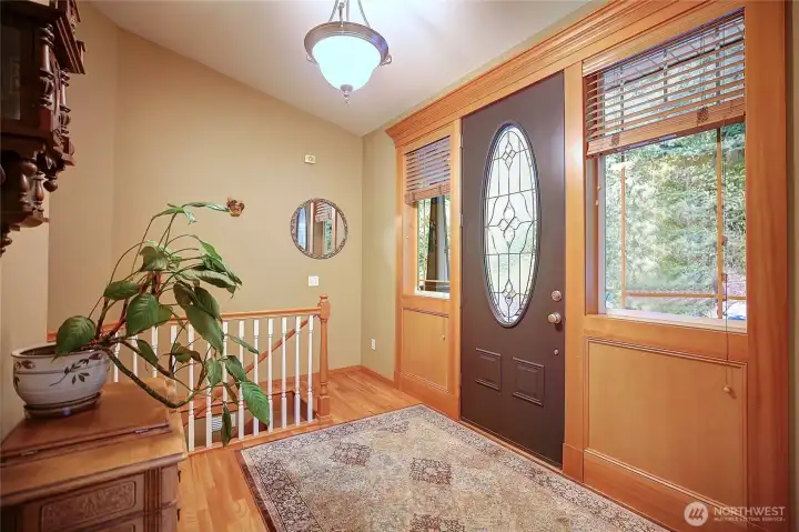 Welcoming foyer previews a meticulously crafted interior and high end finishes. Curving stairway with thoughtful floor lighting leads to lower level living areas.
