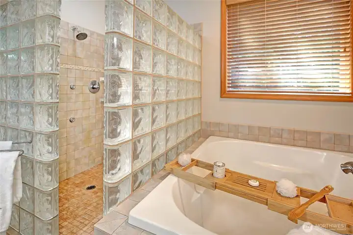 Deep soaking tub and oversized glass block enclosed shower. Enjoy the luxury of stepping out onto a comfortably heated floor.