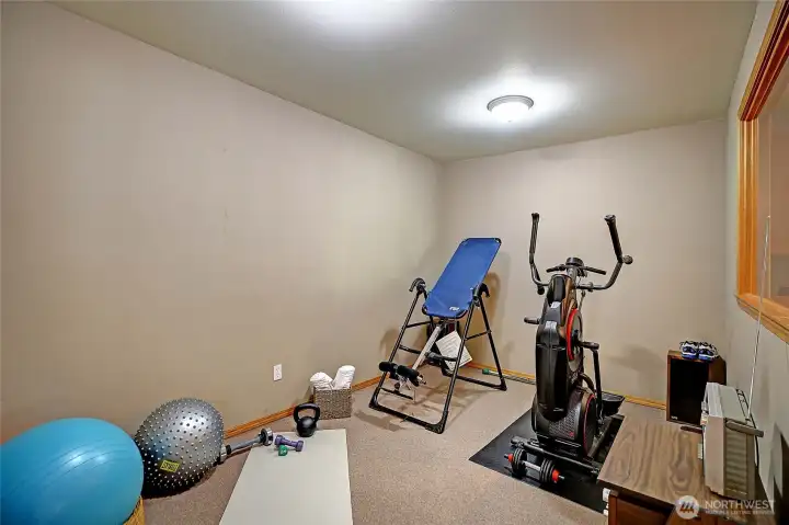 Gym, workout room is adjacent to rec/media room. Handy half bath to meet your needs.