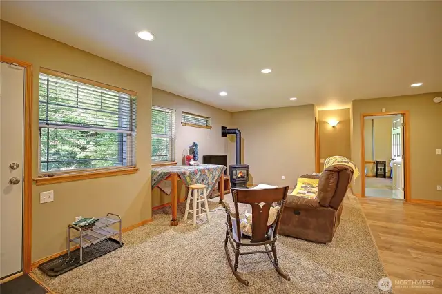 Apartment great room with cozy gas fireplace. Separate entrance. Honey oak hardwood floors.