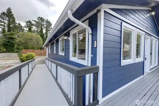 Wrap around deck with handicap ramp to the front door.