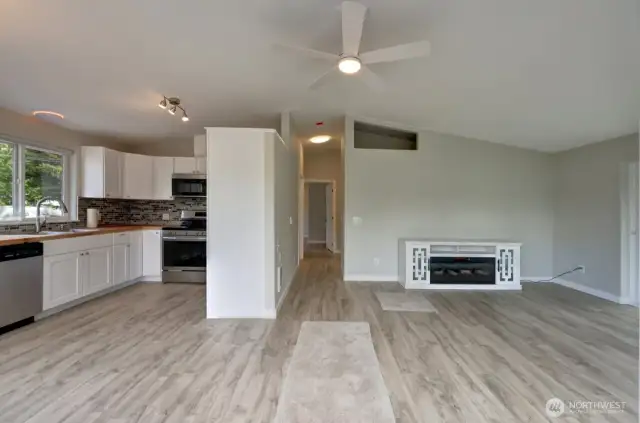Welcome home. Completely updated kitchen with new flooring, cabinets, fixtures, appliances and lighting to the left, hallway the the bedroom's, bathrooms and utility room. Living room to your right.
