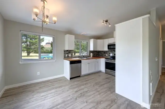 Completely updated kitchen/dining room with new flooring, cabinets, fixtures, appliances and lighting.