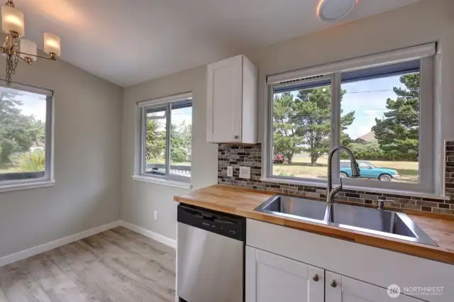 Completely updated kitchen with new flooring, cabinets, fixtures, appliances and lighting.