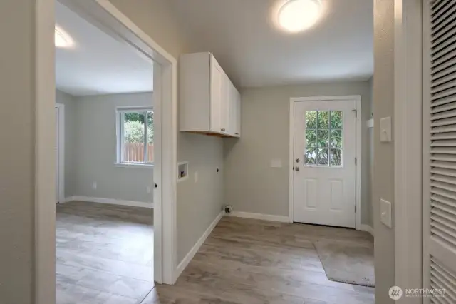 Plenty of room in this laundry located centrally to the bedrooms, bathroom and back door with handicap ramp. The doorway goes to bedroom #2.