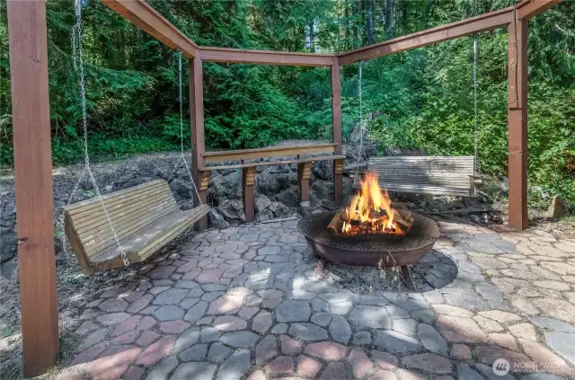 Porch swings make this an extra special place to enjoy the firepit