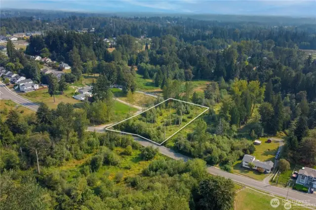 Aerial view of this large 1.685 flat acres ready to buy and use for all your needs.  All utilities are in the street in front of property