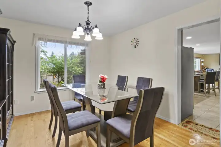 The formal dining room flows seamlessly into the kitchen, making entertaining and everyday meals both convenient and welcoming.