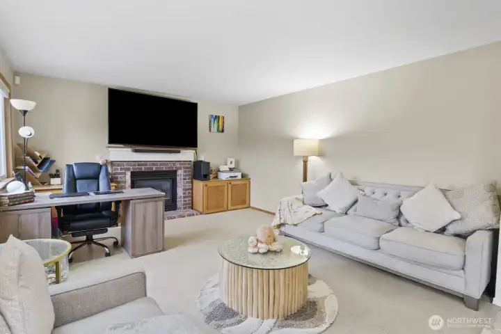 This versatile room comfortably fits a full-size couch and an office desk, making it perfect for working from home, hosting gatherings, or just relaxing and having fun.